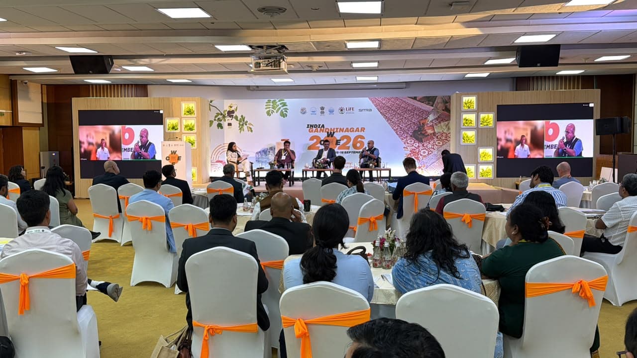Gandhinagar event in India with participants gathered for a global conference.